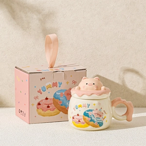 Detail of cartoon pig ceramic mug set with 3D pig lid and matching gift box packaging