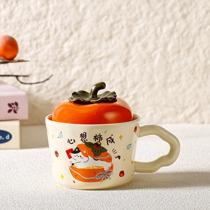 Detail of ceramic persimmon mug with 3D lid and wavy handle showing feline graphics