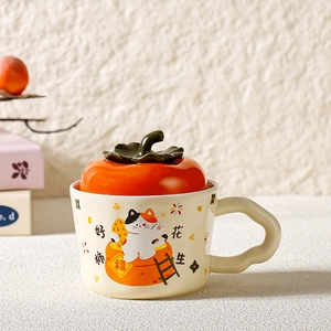 Detailed view of ceramic mug with orange persimmon lid and wavy handle design