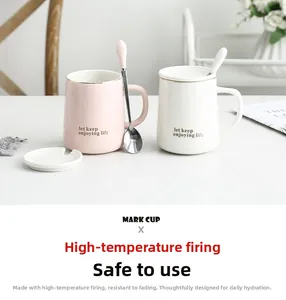 Detail view of pink and white ceramic mugs with gold rims and matching lids and spoons