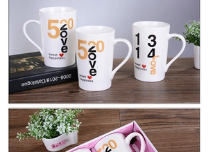 Detail of three ceramic mugs with 520 Love and 1314 Love prints in pink gift box
