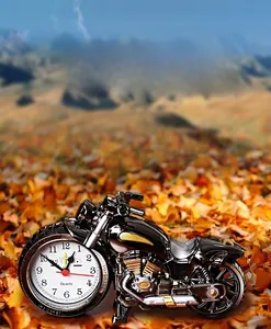 Creative motorcycle alarm clock featuring gold accents on a glossy black plastic body