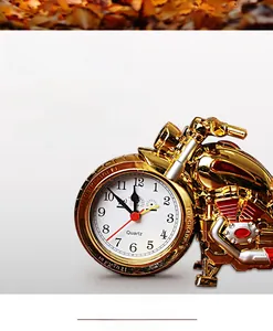 Detailed view of creative golden motorcycle alarm clock with quartz movement and engine design