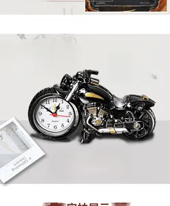 Detail view of motorcycle-shaped alarm clock featuring a polished black finish and quartz dial