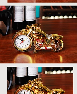 Macro detail of golden motorcycle desk clock front wheel with quartz dial and top grade trim