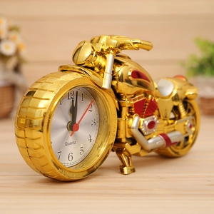 Creative golden motorcycle alarm clock with vintage quartz dial in a cozy home setting
