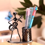 Industrial style iron pencil holder with guitar player figure and mesh pen cup on desk