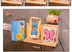 Wooden desk organizer with blue sand hourglass and butterfly sticker, 134mm by 102mm size