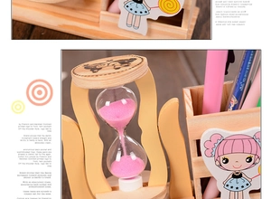 Detail of wooden desk organizer featuring a pink hourglass and cartoon bear branding