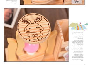 Detailed close-up of a wooden desk organizer featuring a cute rabbit engraving and LOVE text