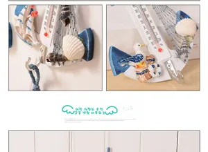 Nautical anchor wall hook with built-in thermometer and detailed Mediterranean seashell decor