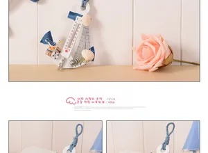 Detail of Mediterranean anchor wall thermometer with nautical shell and fish decor