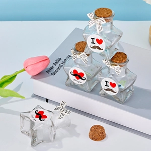 Star shaped glass wishing bottles with cork stoppers and colorful paper strips inside