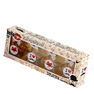 Star-shaped glass wishing bottles in a floral gift box with honey-like liquid contents