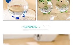 Detailed view of colorful handmade glass pig figurines with polished crystal finish