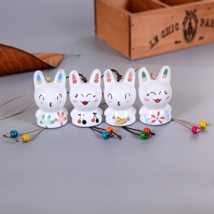 Set of four cute ceramic rabbit wind chimes with floral patterns and colored beads