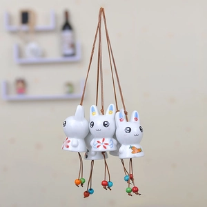 Handcrafted ceramic rabbit wind chime with floral pattern and colorful wooden beads