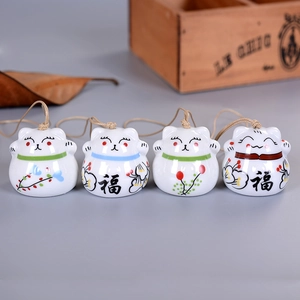 Set of four Japanese ceramic lucky cat wind chimes with vintage hemp rope and floral decor