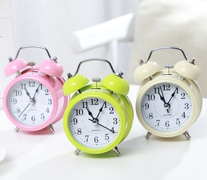Three colorful twin bell metal alarm clocks with quartz movement for children