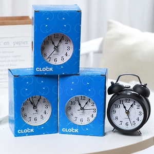 Classic black twin bell quartz alarm clock with matte finish and blue packaging box