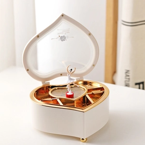 Heart-shaped music jewelry box with rotating girl and mirror in white and champagne gold
