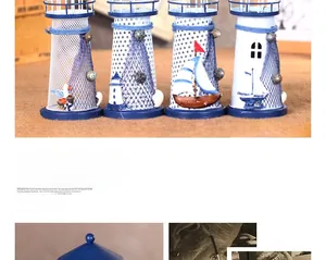Close-up of Mediterranean metal lighthouse ornaments with rope and seashell details