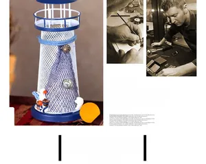 Detail of vintage blue iron lighthouse ornament with maritime nets and shells