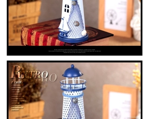 Detail of Mediterranean lighthouse decor with sea shells, fishing nets and blue trims