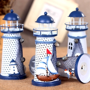 Nautical blue and white iron lighthouse decor with seashells and LED base