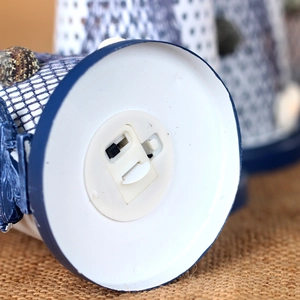 Mediterranean lighthouse decor with detailed bottom switch and seashell nautical elements
