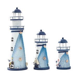 Three-piece Mediterranean blue and white metal lighthouse set with seashell and net details