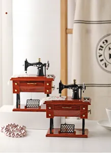 Detailed retro sewing machine music box with vintage wooden grain finish and metal parts