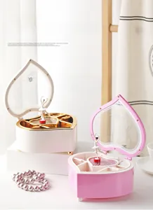 Detail view of heart-shaped music jewelry box with ballerina and built-in vanity mirror