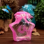 Pink star-shaped glass wishing bottle with a silk ribbon bow and heart-shaped pendant