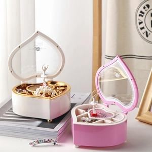 Heart-shaped ballerina music boxes in pink and white with jewelry storage compartments