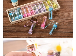 Macro detail of zodiac glass wishing bottles with cork stoppers and dried flower fillings