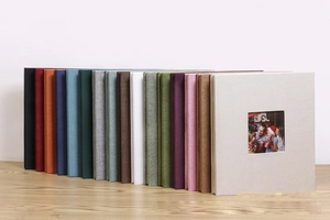 Close-up of fabric photo albums with front window display in various vibrant colors