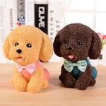 Detail of cute teddy dog resin figurines with realistic fur texture and bow accessories