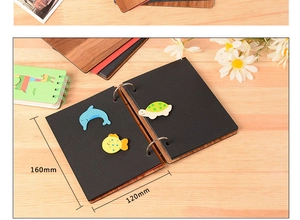 Detail of 6-inch wooden heart photo album showing dimensions 160x120mm and black inner pages