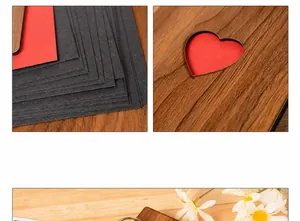 Detail of wooden 6-inch heart-shaped DIY photo album with thick black pages