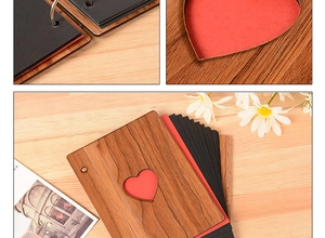 Detail of wooden 6 inch photo album with heart cutout and metal binder rings