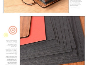 Macro detail of wooden heart album featuring thick red and black cardstock pages