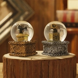 Macro shot of vintage phonograph crystal balls on a wood stump for home decor