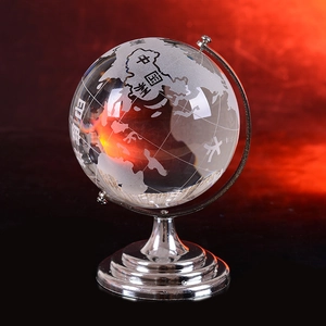 Polished crystal globe with frosted world map and silver metal base for home decor