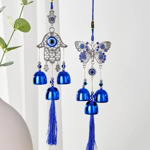 Hamsa Hand and butterfly wind chimes with Evil Eye charms and blue silk tassels