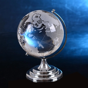 Transparent crystal globe with silver metal base showing Asia map for office decor