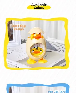 Detail of creative yellow duck egg alarm clock with quartz movement for children bedside