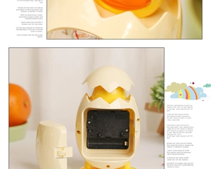 Macro detail of the cartoon chicken alarm clock showing the quartz movement and battery slot