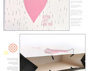 Nahaufnahme der stilvollen Geschenktüte mit rosa Herzen und Better Life for You Text