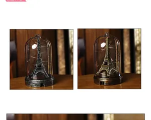 Eiffel Tower glass dome with LED string lights and vintage base in silver and bronze